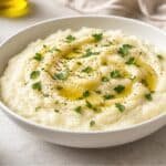 cauliflower mash with olive oil and herbs in a bowl, low-carb side for blood pressure support